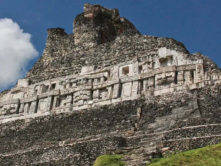 The carved stucco frieze near the top of El Castillo